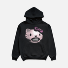 Black hoodie featuring a graphic of a light pink cat head with diamond grillz in her teeth and a pink bow on her ear, offering a blend of cute and edgy style.