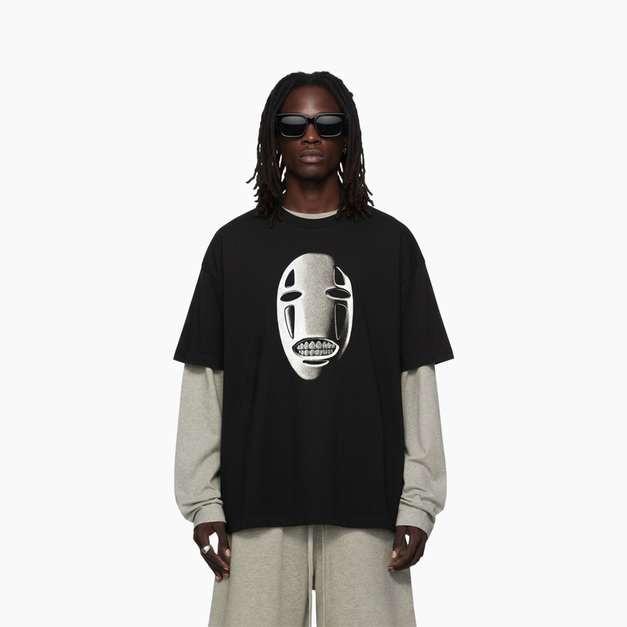 Person wearing a black t-shirt with a white graphic design on a white background