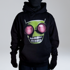 Model wearing a black hoodie with a graphic of a green alien head featuring large red eyes and diamond grillz, standing against a neutral background.