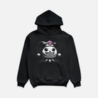 Black hoodie showcasing a stylized character head with pigtails and a pink skull motif, complete with diamond grillz.