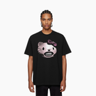 Person wearing a black t-shirt with a graphic design on a white background